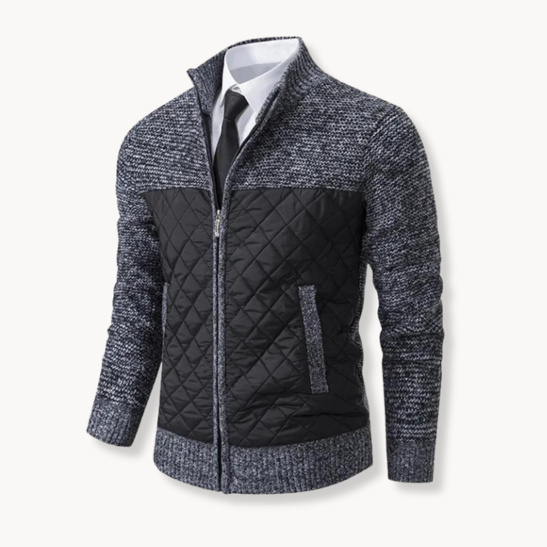 Grey and black quilted jacket on a white background