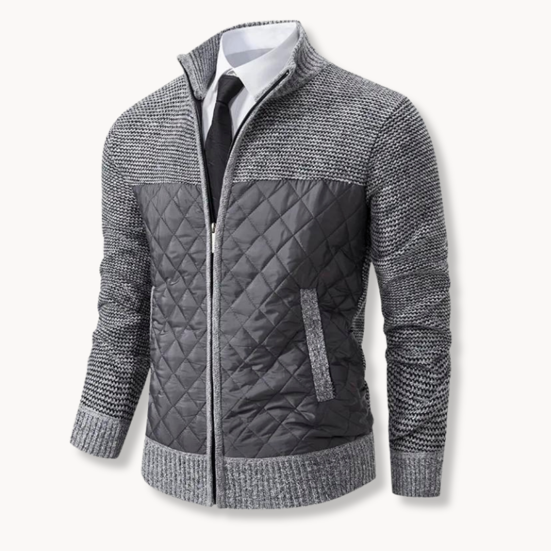 Gray quilted jacket with patterned design on a white background